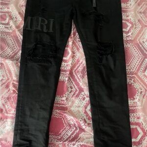 AMIRI Jet Black Ripped Skinny Jeans